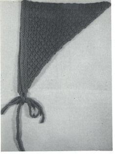 a crocheted triangle is tied up to the side with a knot around it