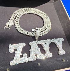 "Custom Big Nameplate Necklace with Cuban Chain,Iced Out Personalized Name Pendant Charm,Custom Hip Hop Name Jewelry,Gift for Her Birthday Can be personalized 🏅it is a trendy baguette letter cubic zircon font letter pendants.made of brass and cubic zircon  stones, White color stones 🏅Each Piece Comes With Cuban Chain: 16\"/18\"/20\"/24\" 🏅Each Piece Packed with Gift Box 🏅100% Made to Order Handmade item Materials: AAAA Cubic Zirconia Stones, Brass 🏅Birthday gift for him*Elegant gift for Mom White Metal Jewelry For Birthday, Bling Chain Necklace For Gift, Chain Link Necklace With Bling For Gifts, Silver Custom Name Necklace For Party, Silver Party Necklace With Custom Name, Silver Pendant Name Necklace For Party, Silver Nameplate Necklace For Party, Silver Name Necklace With Chain For Party, Silver Nameplate Chain Jewelry