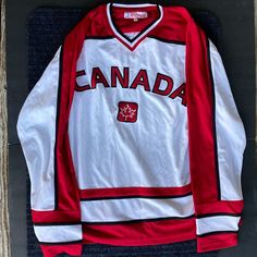 a canada hockey jersey hanging on a wall