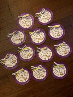 purple and white volleyball themed coasters on wooden floor