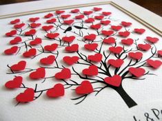 a card with hearts on it and the words love is in the tree written below