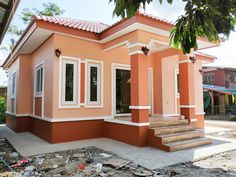 a house that has been painted orange and white