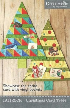 two christmas trees are shown on the cover of cross stitchs magazine, which is featured in