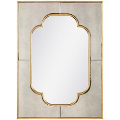 a mirror that is sitting on top of a table with a gold frame around it