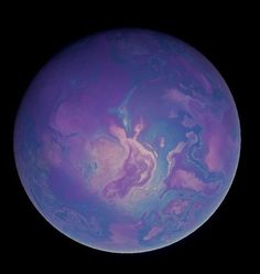 the planet is purple and blue with some clouds on it's surface, as well as