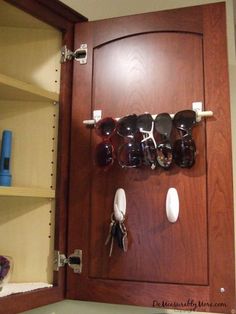 an open door with sunglasses and other items on it