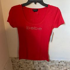 Red Bebe Tee W/ Rhinestones (New) Bebe Clothes 2000s, Bebe Shirt, Red Clothing Aesthetic, Y2k T Shirt, Red Tops, 2000s Shirts, Bebe Shirts, Batwing Shirt, 2000 Clothes