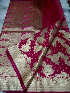 Heavy kataan Benarasi silk saree for wedding, woven with heavy gold zari thread. This rich saree is ideal for wedding wear, teams best with gold jewellery. Traditional wedding wear. Saree length is 5.5m with 0.8m blouse piece. Semi-stitched Paithani Silk Saree For Wedding, Wedding Jamawar Pre-draped Saree With Zari Weaving, Semi-stitched Banarasi Silk Blouse Piece With Pallu, Wedding Meenakari Katan Silk Pre-draped Saree, Katan Silk Pre-draped Saree For Wedding And Diwali, Banarasi Silk Pre-draped Saree With Zari Weaving, Tussar Silk Meenakari Saree For Eid, Meenakari Tussar Silk Saree For Eid, Unstitched Meenakari Saree