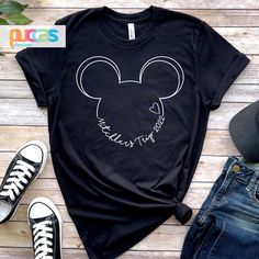 a mickey mouse head with the word minnie on it's chest and ears drawn in white