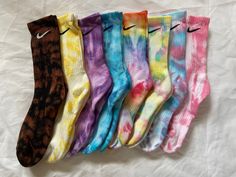 Tie dye Nike socks Available in a variety of colours, examples shown in photo 2. Colours and pattern can vary between each pair due to the individual hand dyed nature.  Available in: Adult UK Sizes 2-5, 5-8, 8-11 and 11-14.5 Child UK Sizes 6.5-9.5 & 9.5-2.5 All available in the shorter ankle quarter style and the longer crew style  Message if you have any questions or would like a specific colour combination which is not listed on the drop down. Can do up to 3 colours per pair All socks are bran Casual Multicolor Handmade Socks, Casual Handmade Multicolor Socks, Handmade Multicolor Casual Socks, Rainbow Colour, Tie Dye Socks, 4 December, Nike Socks, Colorful Socks, Colour Combination