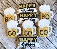 birthday cookies decorated with beer mugs and the number 50