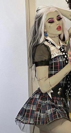 a woman dressed up as a creepy doll