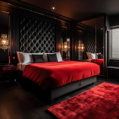 a bedroom with black walls and red bedding in the center, along with a rug on the floor