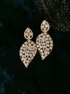 Material        : Silver Gemstone: Moissanite,  Stone colour:  Uncut Polki Primary colour: Gold Closure        : Screw back  Length: 5.5 cms  Width : 2.5 cms Intricate, hand crafted, Pure Silver Polki Earrings, studded with high quality Moissanite Polki ,made in 92.5 real silver with 22ct gold plating.  Product comes with 92.5 silver hallmark. All our pieces are in stock and will be dispatched with in 24 to 48 hours of order. Orders received  during the weekend will be dispatched on Monday Moissanite Drop Earrings For Wedding, Wedding Moissanite Drop Diamond Earrings, Wedding Moissanite Drop Earrings, Wedding Earrings With Diamond Accents And Moissanite, Moissanite Earrings With Diamond Accents For Wedding, Wedding Earrings With Moissanite And Diamond Accents, Elegant American Diamond Earrings For Reception, Wedding Moissanite Earrings With Diamond Accents, Dazzling Moissanite Wedding Earrings