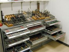 an assortment of tools are displayed on shelves