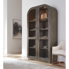 a large wooden cabinet sitting in the corner of a room