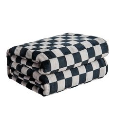 three black and white checkered towels stacked on top of each other