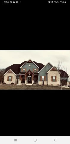 a large house sitting in the middle of a field