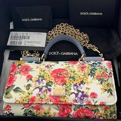 New With Tags Leather Floral Dolce & Gabbana St. Dauphine Bag In St. Fiori Print - Limited Edition. Floral Print With Baby Blue Detailing. Approximately 7” Wide And 4” Tall. Holds 7 Credit Cards/Ids Plus Iphone, And Cash. Includes Original Box, Tag, Card Of Authenticity, And Holder. Protective Plastic Wrap From Front Hardware Is Still In Place. House Additions, Cell Phone Bag, Floral Bags, Leather Floral, Plastic Wrap, Phone Bag, Credit Cards, Baby Blue, White House