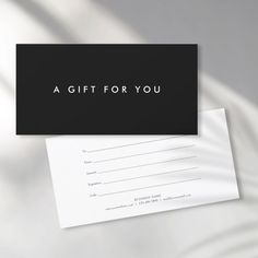 a black and white business card with the words a gift for you on it