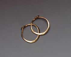 Hand forged out of solid 14 karat yellow gold wire, this pair of tiny everyday hoops has a secure locking clasp. There is an artisan ball peen 14k Gold Hoop Earrings, Small Gold Hoops, Diamond Hoop Earrings, Jewelry Inspo, Gold Hoops, Pretty Jewellery, Gold Hoop, Copper Jewelry, Gold Hoop Earrings