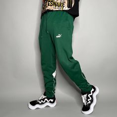 "Vintage Puma Joggers Forest Green Polyester Sweatpants White Logo has Ankle Zippers Soccer Style Slim Fit 90s Skate / Streetwear Great Condition: 9/10 Men's Size: Large My Hands in Pockets = It has Pockets No Hands in Pockets = Does Not Have Pockets Drawstring Will be Visible in Forward Pic, if not Visible it Does Not Have a Drawstring About me: I am 6' 0\" for reference I generally wear a Large (32\" inseam) I Model XS to 2XL sweatpants, I find that you can often size up or down with 95% of sweatpants and they fit the same" 90s Skate, Forest Green, Mens Pants, Sweatpants, Soccer, Zipper, Slim Fit, Street Wear, Mens Outfits