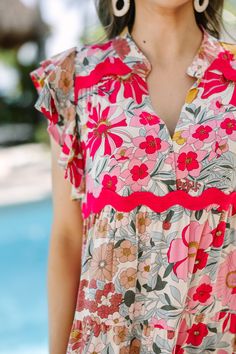 We honestly can't think of a more perfect spring/summer dress! That floral print and those hues are stunning together and we love that rickrack detailing. Rickrack is so trendy right now! V-neckline Ruffled sleeves Floral print Rickrack detailing No stretch Savannah is wearing the small. Feminine Pink Dress With Floral Patchwork, Spring Multicolor Floral V-neck Dress, Multicolor Floral V-neck Dress For Spring, Multicolor V-neck Floral Dress For Spring, Spring Vacation Rayon Floral Dress, Spring Floral V-neck Dress With Vibrant Print, Spring Vacation Floral Rayon Dress, Multicolor Floral V-neck Dress With Vibrant Print, Spring Rayon Floral Dress