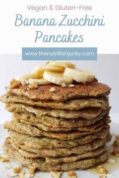 banana zucchini pancakes stacked on top of each other with nuts and bananas in the background