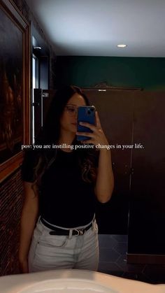 a woman taking a selfie in a bathroom mirror with the caption, you are exciting positive changes in your life