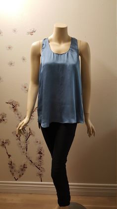 This is 100% pure silk satin tank top (teeback). Cut from a lightweight silk, this silk bias top features an amazing color of fabric (we call it denim blue :) The weight of satin used here is of 80 gms per meter. This is made to order piece and can be made to order in any color and size and length in 2-3 weeks time. Please chose your desired color from the shade chart.   Care: Dry clean only or hand wash. Correct care will insure that you silk products will last for years without losing their quality. A few important rules need to be observed as silk is a natural fiber and cannot be treated as synthetic fiber. → Never spray silk with perfume or deodorant → Never bleach silk → Never expose silk to direct sunlight for longer periods of time → Don't spray silk with water while ironing → Don't Silk Products, Satin Tank Top, Silk Lingerie, Silk Tank, Satin Top, Silk Material, Luxury Clothing, Synthetic Fiber, Denim Blue