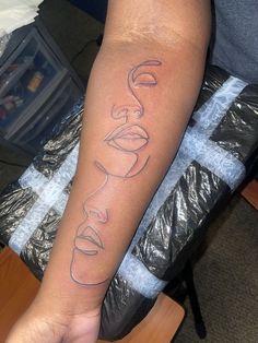 a person with a tattoo on their arm