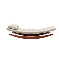 a white couch sitting on top of a wooden frame