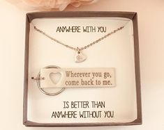 a box with two necklaces in it that say, where you go, come back to me is better than anywhere without you