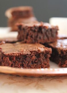 chocolate brownies on a plate with one cut in half