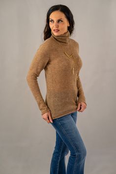 Elevate your cold-weather collection with our slim fit heathered turtleneck sweater, a harmonious blend of comfort and style. This camel textured knit top features subtle color flecks, adding depth to the classic design. With its sophisticated high neckline and versatile appeal, this sweater is an essential piece for layering or as a standalone statement. 

60% Baby Alpaca
5% Merino Wool
35% Polyamide
Made in Peru

DRY CLEAN Brown Fine Knit Turtleneck For Winter, Winter Brown Fine Knit Turtleneck, Fine Knit Beige Turtleneck For Fall, Brown Funnel Neck Turtleneck For Fall, Brown Cable Knit Turtleneck For Fall, Classic Brown Funnel Neck Turtleneck, Elegant Brown Turtleneck For Workwear, Brown Cashmere Turtleneck Top, Brown Funnel Neck Sweater For Layering