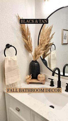 a bathroom with a sink, mirror and towel rack