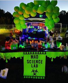 the mad science lab is set up with balloons and candles for halloween party guests to enjoy