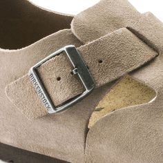 Birkenstock London Taupe Suede Leather Shoes The BIRKENSTOCK London is a variation on the classic Boston clog. The strap's adjustability ensures a perfect fit, making the clog a comfortable companion for many occasions. This season luxurious suede leather creates a striking and chic look. Features:  Anatomically shaped cork-latex footbed  Upper: Suede leather  Footbed lining: Suede  Sole: EVA  Details: Individually adjustable metal pin buckle  Made in Germany Birkenstock London, Birkenstock Madrid Big Buckle, Taupe Shoes, Suede Shoes Women, Clog Style, London Brands, Clogs Style, Suede Leather Shoes, Birkenstock Women