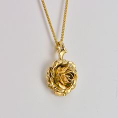 Rose Flower Necklace, 9k Yellow Gold Pendant, Gold Rose Necklace Beautiful yellow rose suspended by delicate thorns, A truly romantic gift! handcrafted in 9ct yellow solid gold * Material: 9ct Fairtrade / recycle UK hallmarked gold * Size of Rose: Approx 1.5 cm (0.4in) diameter * Length of Chain: hallmarked 1 mm Spiga chain 40 cm (16in) long (it could be longer on request ) * Ready to Ship in 10 business day * Made in the United Kingdom Please allow for slight variations in size as every item is Golden Rose Necklace, Flowers Moodboard, Gold Rose Necklace, Rose Pendant Necklace, Shiny Rings, Jewelry Rose Gold, Minimalist Jewellery, Minimalist Pendant, Graduation Jewelry