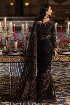 Elegant Pakistani Wedding Dress in Classic Black Shade Net Saree features handcrafted adda embellishments, thread embroidery, and sequins, hanging drapes and cut-out details on the sleeves, and handcrafted tassels on the back. Detailed Description: SKU: WB418 Detailing: Embroidery, Motifs, Naqshi, Sequins, Tilla Color: Black Fabric: Net, Tissue, Cotton Silk Design: Fully Embellished Dress with Embroidery, Goldwork Event: Bridal wear, Wedding Embroidery Goldwork, Hanging Drapes, Wedding Dresses Pakistani, Desi Wedding Dresses, Silk Design, Pakistani Wedding Outfits, Pakistani Wedding Dress, Saree Models, Net Saree