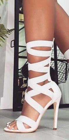 Trendy White Lace-up Sandals For Party, Trendy White High Heel Lace-up Sandals, Fitted Ankle Strap Lace-up Sandals With Straps, Trendy White Ankle Strap Lace-up Sandals, Fitted High Heel Lace-up Sandals With Straps, Chic Strapped Summer Heels, Elegant White Heels With Straps, Strapped Sandals With Wrapped Heel For Party, Trendy White Sandals For Night Out