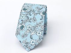 "Light Blue 936 Floral Wedding Tie, Wedding Men's Tie, Light Blue 914 Floral Bow Tie, Light Blue 914 Floral Pocket Square Light blue floral Wedding tie is one of our most favorite groomsmen ties chosen to outfit wedding party. The fine fabric on this necktie gives off the great shine and looks great at any formal or informal gatherings. Even though this light blue floral men's tie is so popular for weddings, it is still an ideal choice for business attire. Great design and texture tie gives you more confidence and attracts more attention.  This light blue floral bow tie is ideal for those that are looking for a trendy tie that adds color to the shirt without being too flashy or overpowering. Perfect for weddings, business meetings, casual throw, and proms! This classy tie is a great finish Blue Suit And Tie Accessories For Wedding, Blue Classic Wedding Suit And Tie Accessories, Blue Wedding Suit And Tie Accessories, Blue Suit And Tie Accessories For Groom, Blue Fitted Suit And Tie Accessories For Wedding, Elegant Light Blue Suit And Tie Accessories For Wedding, Blue Wedding Ties, Floral Wedding Tie, Blue Floral Bow Tie