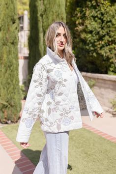 The stunning Hailey Shacket features a beautiful floral embroidered design on a crisp white background, making it a must-have this season. With its long sleeves, button down front, and large side pockets, this shacket not only adds style but also practicality to any outfit. Details + Fit 100% Polyester Runs True to Size Hand Wash Cold Hang Dry Collared Neckline Long Sleeves Button Down Front Large Side Pockets Quilted Floral Embroidered Design White | Multi | Printed Model is 5'6" and wearing a size Small Quilted Shacket, Embroidered Quilts, Embroidered Design, Outfit Details, Must Haves, White Background, Hand Wash, Long Sleeves, Long Sleeve