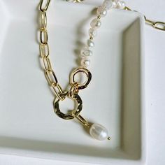 Introducing the HEBE Necklace—a sophisticated piece that embodies femininity and luxury. Crafted with exquisite freshwater pearls, this necklace offers effortless elegance that will stand the test of time. Its intricate and delicate design makes it a treasured companion for any wardrobe, perfect for both special occasions and everyday wear. Key Features: - Length: A beautiful 16-inch necklace that sits gracefully on the collarbone, enhancing your neckline with a touch of sophistication.- Lead an Chic Pearl Necklace With Adjustable Chain, Chic Pearl Chain Necklaces, Feminine Pearl Chain Necklace, Chic Long Pearl Drop Necklace, Chic Pearl Drop Chain Necklace, Chic Pearl Chain Necklace As Gift, Chic Pearl Necklace With Pearl Charm, Chic Pearl White Necklace With Pearl Charm, Everyday Feminine Pearl Necklace With Charm