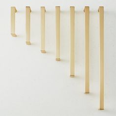 a row of wooden dows on a white wall with no one in the photo