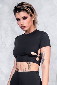 Conquer the rave scene in this astonishing, all-black piece. FEATURES: > High Neck > Short Sleeves > Cutouts On Both Sides > O-Ring Details On Both Sides > 90% Polyester / 10% Elastane Rave Scene, Rave Festival, Back To Black, Alternative Fashion, O Ring, All Black, High Neck, Crop Top, Short Sleeves