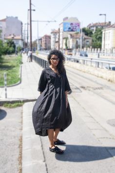 "Linen Oversize Loose Dress, Black Linen Dress, Plus Size Dress, Extravagant Long Dress, Black Maxi Dress, Summer Black Dress, Linen Dress Designed by Follow Me FS. Linen Oversize Loose Dress is easy to throw on and gives a soft and breezy effect. Featuring 3/4 sleeves, two sides pockets for convenient storage. Go simple and pair it with sandals. ▸FABRIC & CARE High quality Linen Hand Wash / Dry Cleaning Machine Cold Wash / 30 C Do Not Tumble Dry ▸SIZING This model is available in XS \\ S \\ Black Lagenlook Tunic Dress, Oversized Black Midi Dress For Daywear, Black Knee-length Lagenlook Dress, Black Oversized Midi Dress With Short Sleeves, Black Oversized Short Sleeve Dress, Oversized Black Short Sleeve Dress, Black Lagenlook Midi Dress For Summer, Black Oversized Lagenlook Dress, Black Maxi Dress Summer