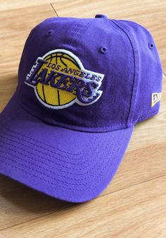 This Los Angeles Lakers Purple Adjustable Hat features a team logo embroidered on the front. Team logo embroidered on the front, Cloth Strap Closure to dial in the perfect fit, Relaxed, unstructured fit, Pre-curved bill, 100% cotton construction, New Era Flag logo on side, Dad hat, 100% Cotton, Washable, Imported Lakers T Shirt, Good Luck Charlie, Flag Logo, Brooklyn Nets, Los Angeles Lakers, Dad Hat, Adjustable Hat, Logo Embroidered, Dad Hats