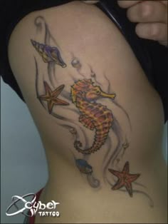 a woman's back with tattoos on her body and starfishs around it