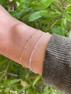 This listing is for ONE beautiful dainty gold filled or sterling silver satellite bracelet.   - Looks so pretty stacked or worn on its own and makes a perfect gift for your loved ones! If unsure of sizing, measure wrist with tape measure and add on 1/2 inch.  It will be a loose fit but will be easier to clasp on.  If you want a snug fit, you can add on 1/4 inch but it will be a little more difficult to clasp. You can also wrap your wrist with a string and measure string against a ruler.   Please Dainty Gold Sterling Silver Bracelet For Everyday, Adjustable Dainty Sterling Silver Bracelet For Everyday, Dainty Beaded Bracelets With Satellite Chain, Dainty Adjustable Sterling Silver Bracelet For Everyday, Dainty Beaded Bracelet With Satellite Chain, Dainty Sterling Silver Adjustable Bracelet For Everyday, Gold Sterling Silver Anklet As Gift, Delicate Adjustable Beaded Bracelets With Satellite Chain, Adjustable Delicate Chain Charm Bracelet